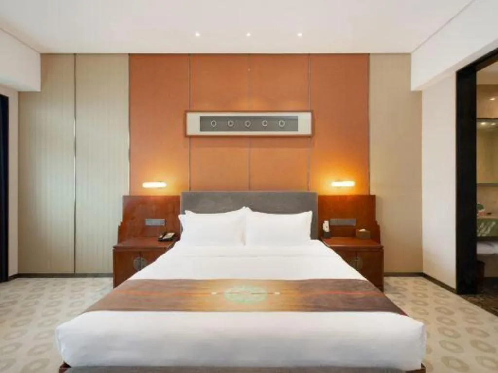 Bed in Rezen Hotel Pasonda Junyu