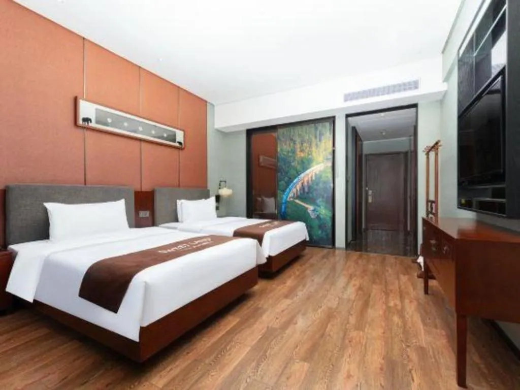 Bed in Rezen Hotel Pasonda Junyu