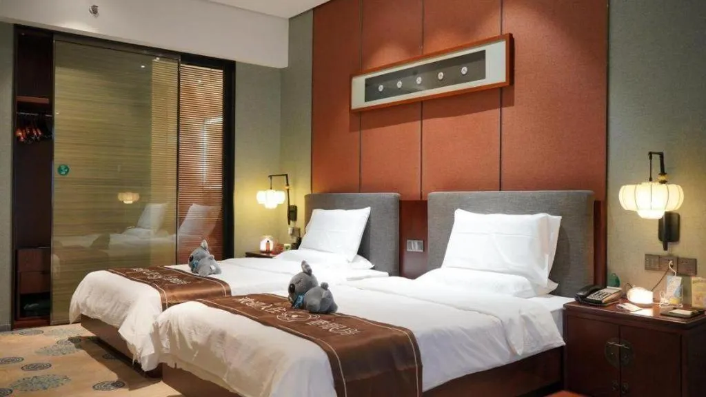 Bed in Rezen Hotel Pasonda Junyu