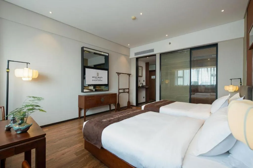 Bed in Rezen Hotel Pasonda Junyu