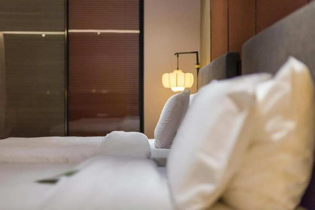 Bed in Rezen Hotel Pasonda Junyu