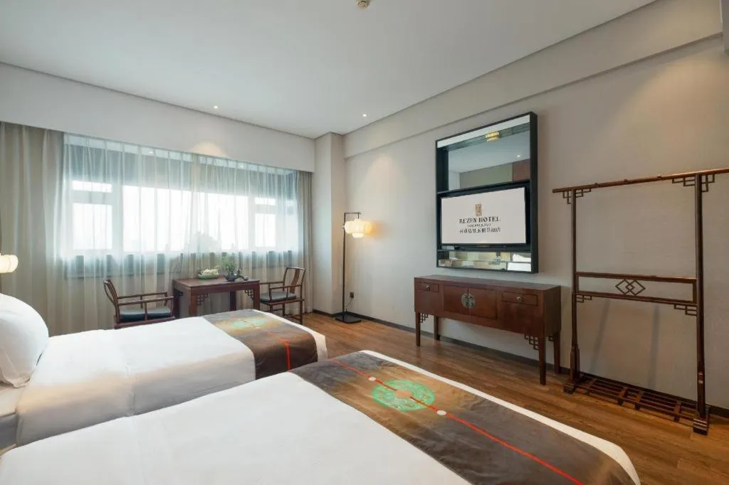 Bed in Rezen Hotel Pasonda Junyu