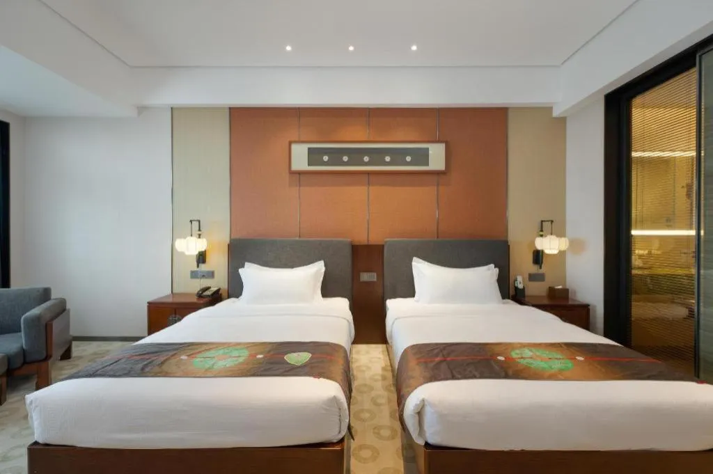 Bed in Rezen Hotel Pasonda Junyu