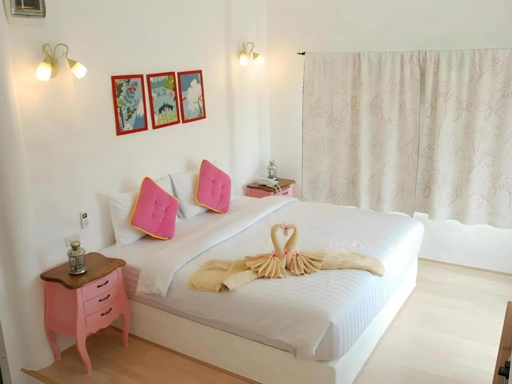 Bed in Rak Na Suan Pueng Resort