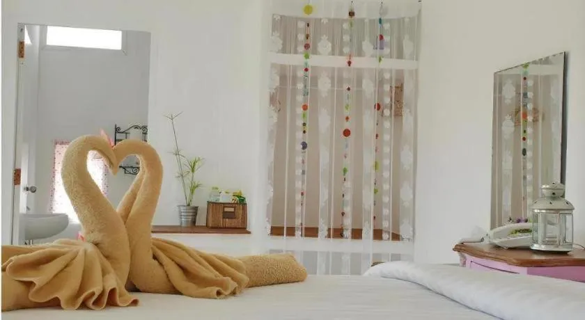 Bed in Rak Na Suan Pueng Resort