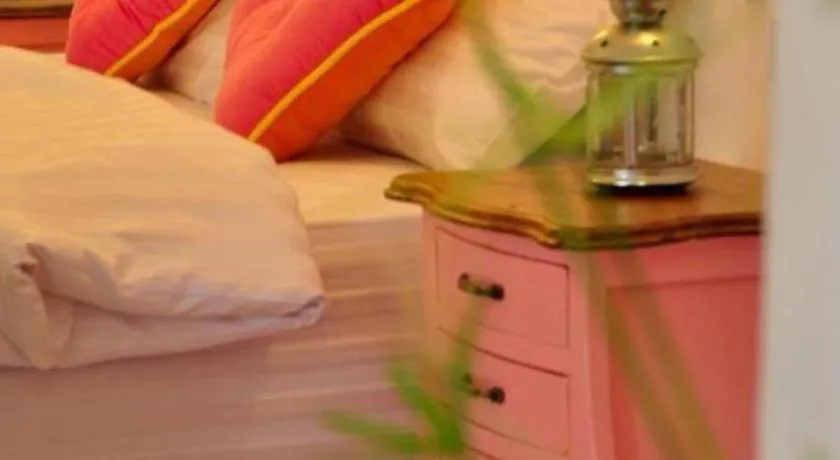 Bed in Rak Na Suan Pueng Resort