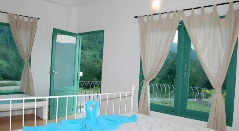 Bed in Rak Na Suan Pueng Resort