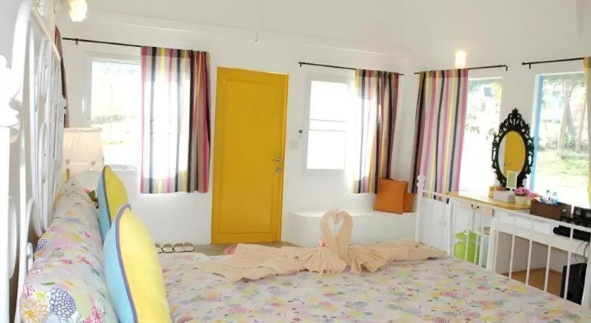 Bed in Rak Na Suan Pueng Resort
