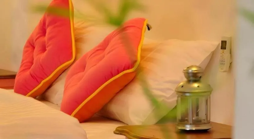 Bed in Rak Na Suan Pueng Resort