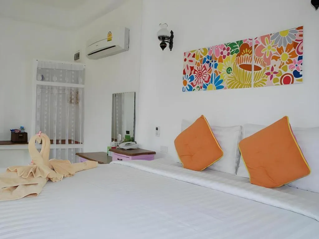 Bed in Rak Na Suan Pueng Resort