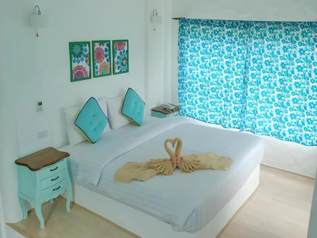 Bed in Rak Na Suan Pueng Resort