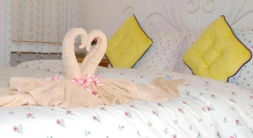 Bed in Rak Na Suan Pueng Resort