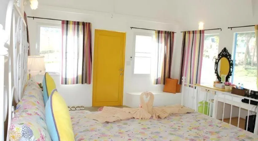 Bed in Rak Na Suan Pueng Resort