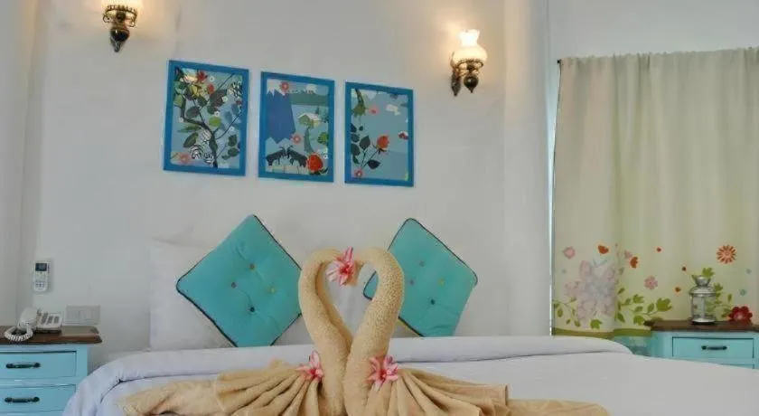 Bed in Rak Na Suan Pueng Resort