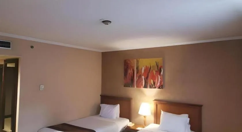 Bed in Regent's Park Hotel at Kayutangan Malang