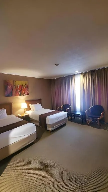 Bed in Regent's Park Hotel at Kayutangan Malang