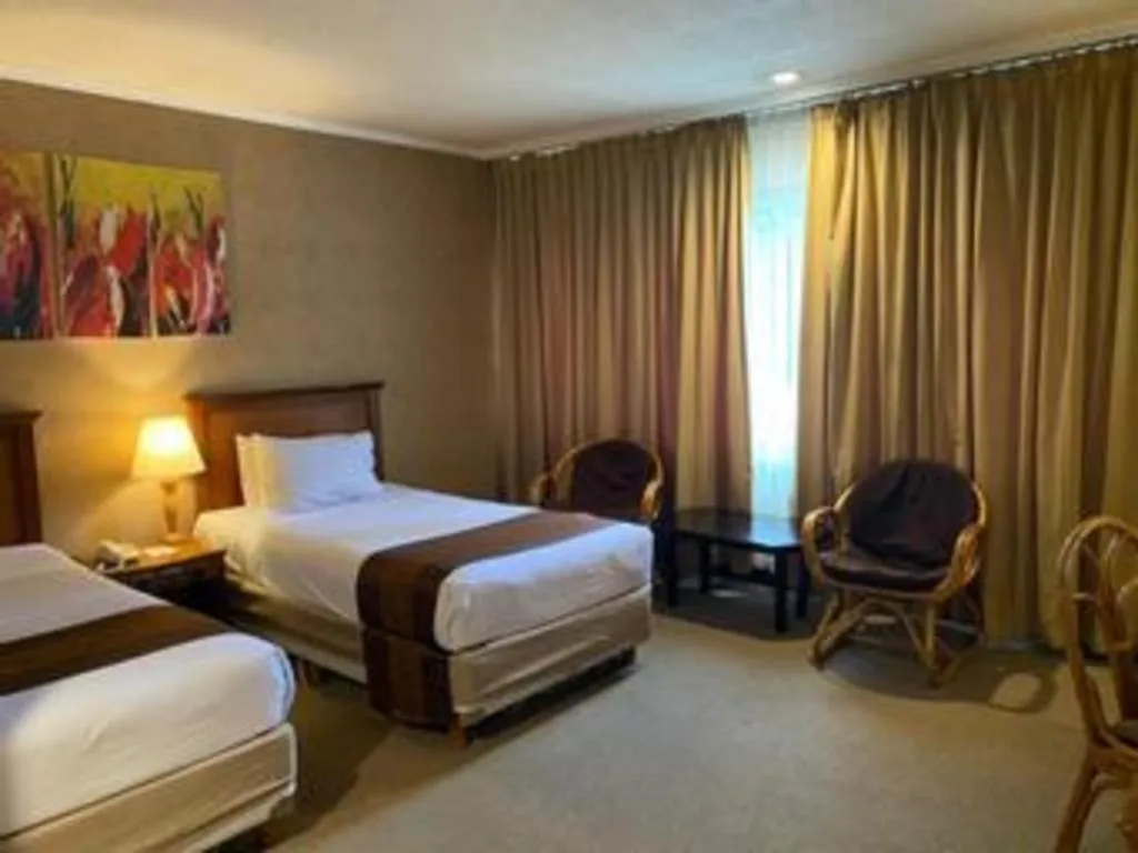 Bed in Regent's Park Hotel at Kayutangan Malang