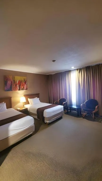 Bed in Regent's Park Hotel at Kayutangan Malang