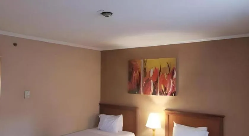 Bed in Regent's Park Hotel at Kayutangan Malang