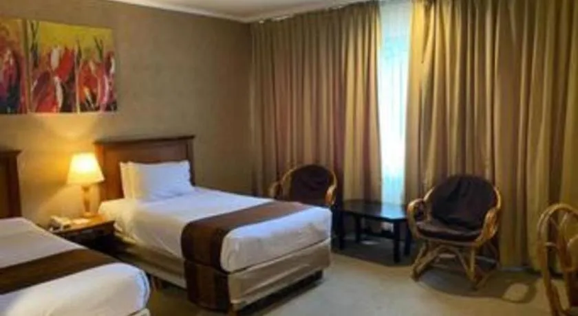 Bed in Regent's Park Hotel at Kayutangan Malang