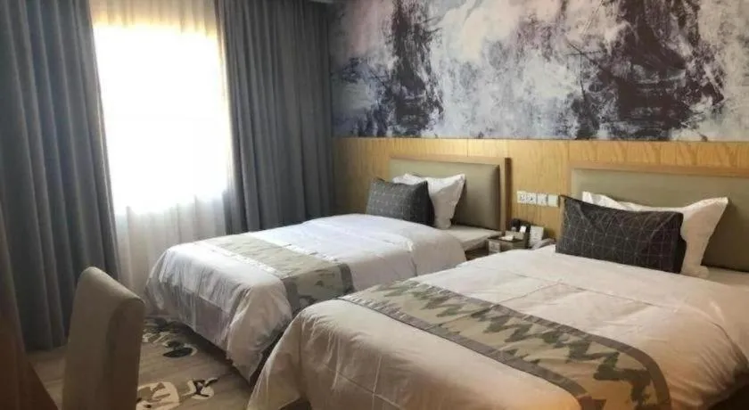 Bed in ST. MORITZ BUSINESS HOTEL