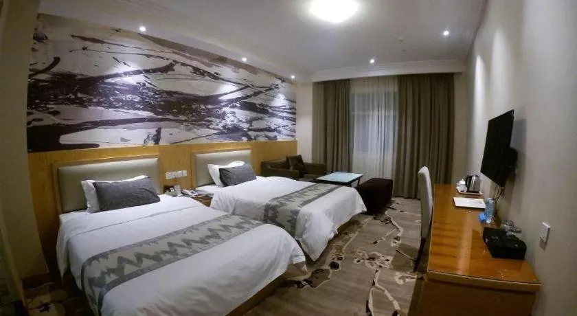 Bed in ST. MORITZ BUSINESS HOTEL