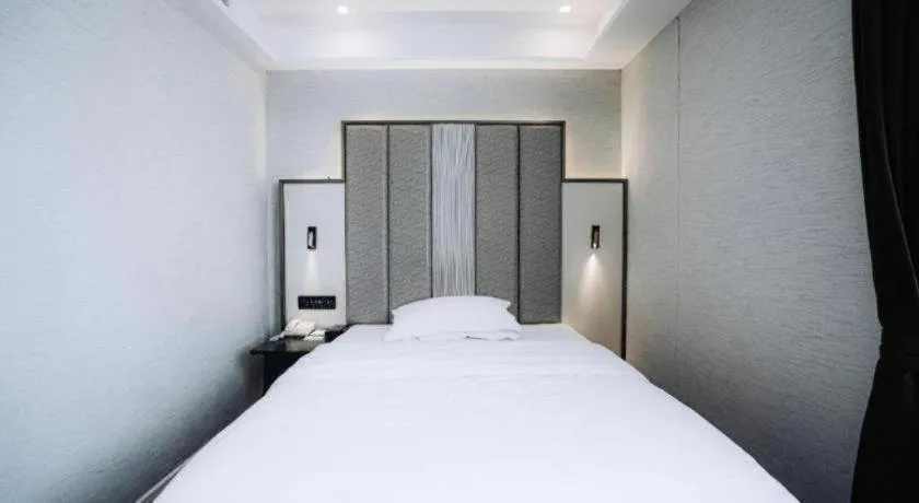 Bed in Jinjiang Metropolo Hotel Nanjing Jiangning Binjiang Development Zone