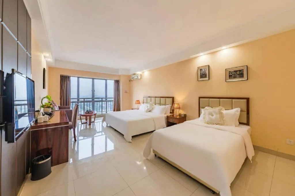 Bed in Foshan Baolong Hotel