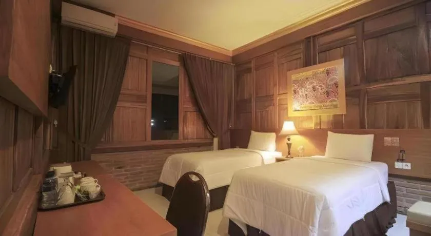 Bed in Parai Beach Resort Telengria