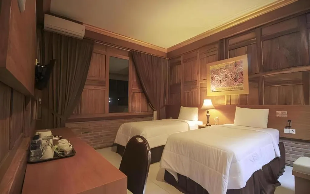 Bed in Parai Beach Resort Telengria