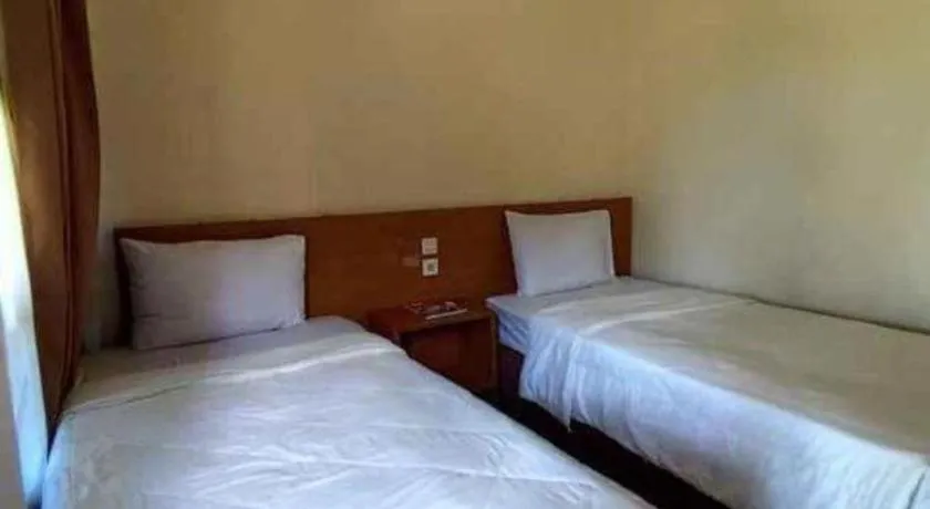 Bed in Parai Beach Resort Telengria