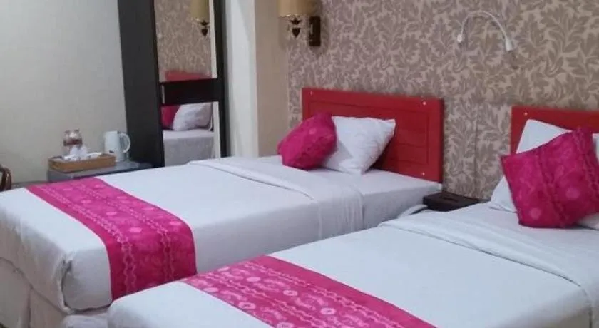 Bed in Queen City Hotel