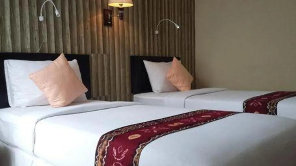 Bed in Queen City Hotel