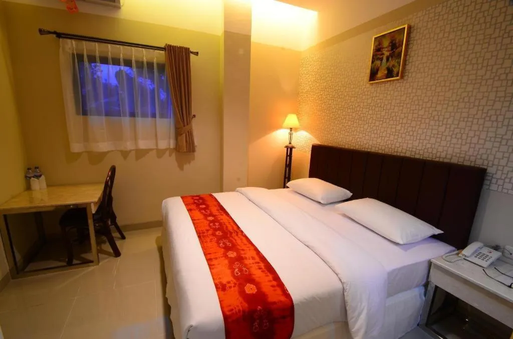 Bed in Queen City Hotel