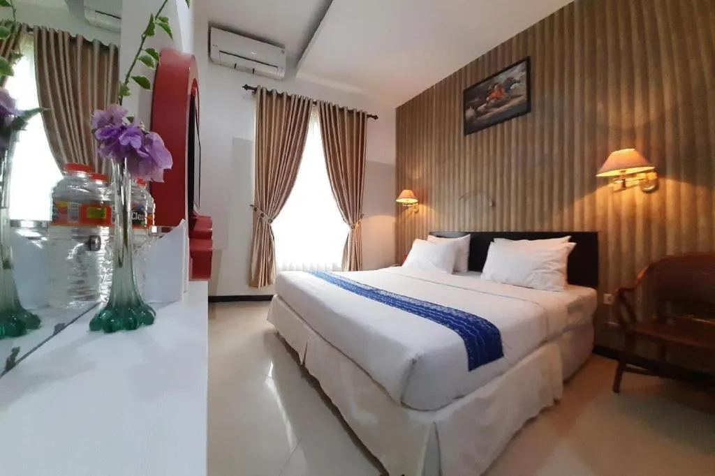 Bed in Queen City Hotel