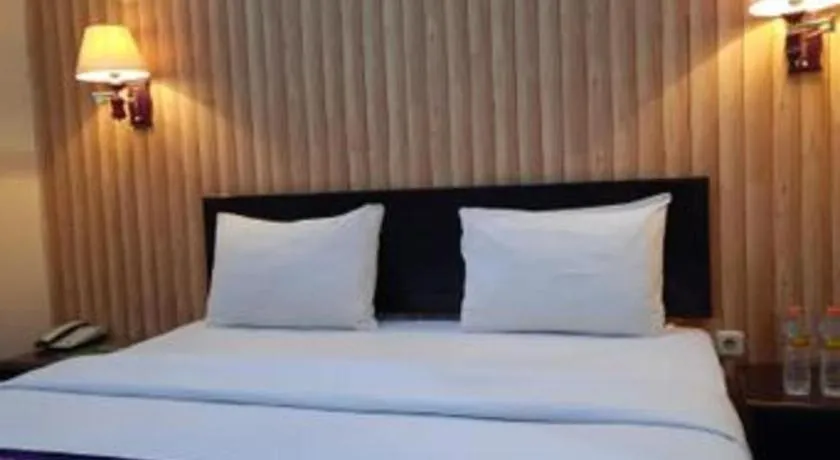 Bed in Queen City Hotel