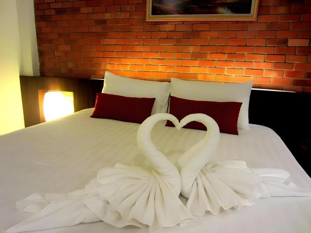 Bed in De Aerng Boutique Hotel