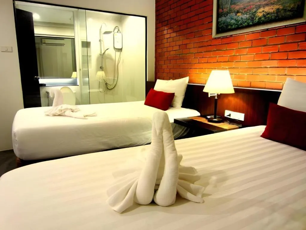 Bed in De Aerng Boutique Hotel