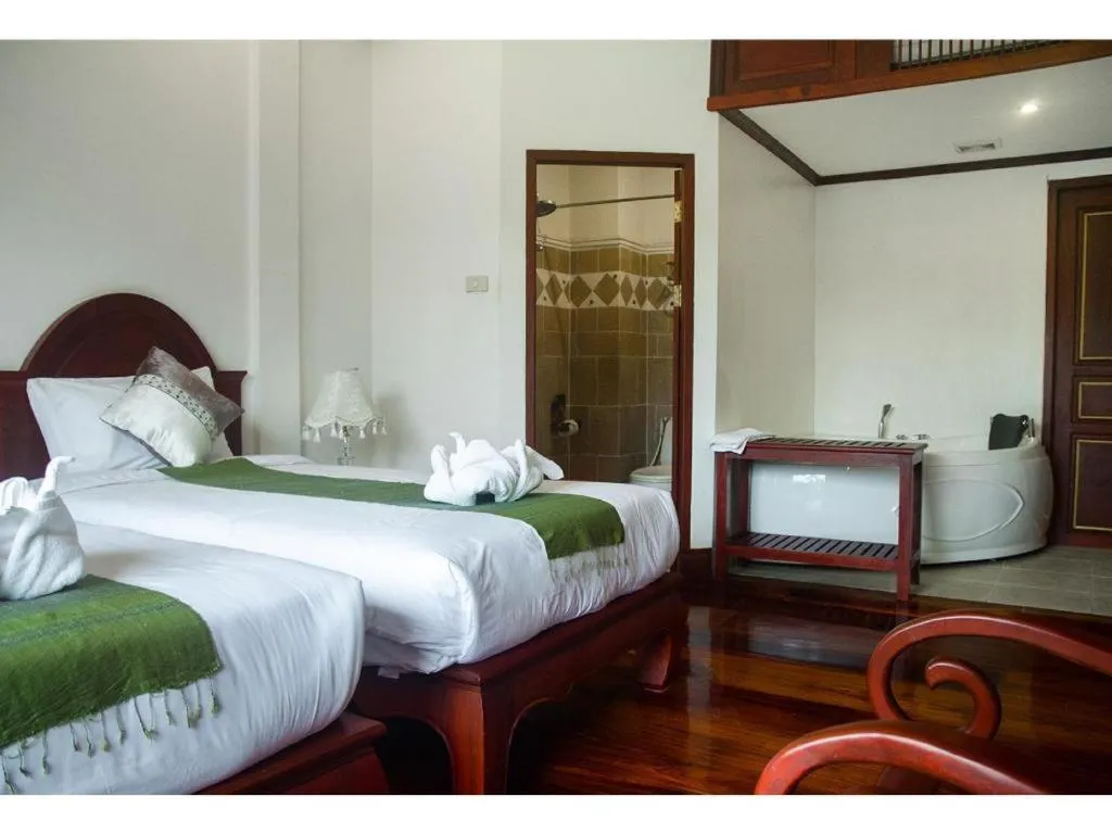 Bed in The View Pavilion Hotel