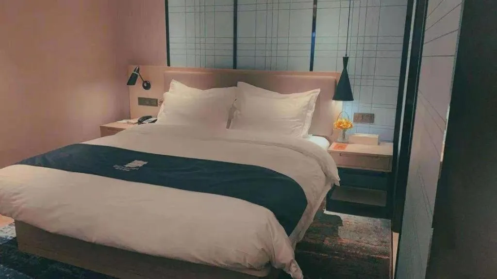 Bed in Echarm Hotel Guilin North High Speed Railway Station