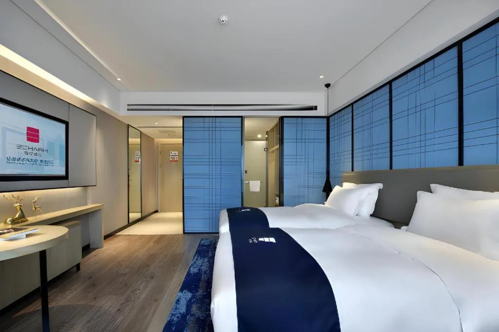 Bed in Echarm Hotel Guilin North High Speed Railway Station
