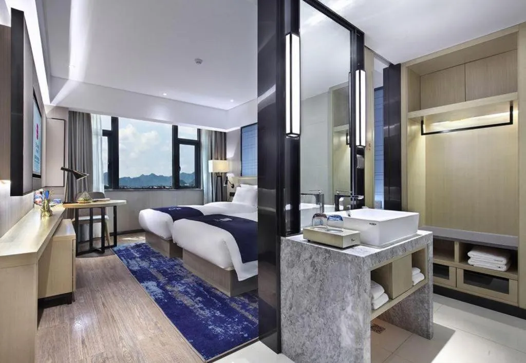 Bed in Echarm Hotel Guilin North High Speed Railway Station