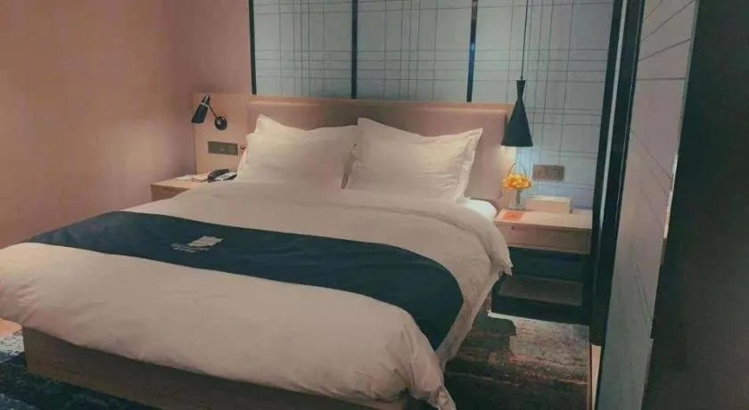 Bed in Echarm Hotel Guilin North High Speed Railway Station