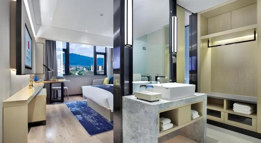 Bed in Echarm Hotel Guilin North High Speed Railway Station