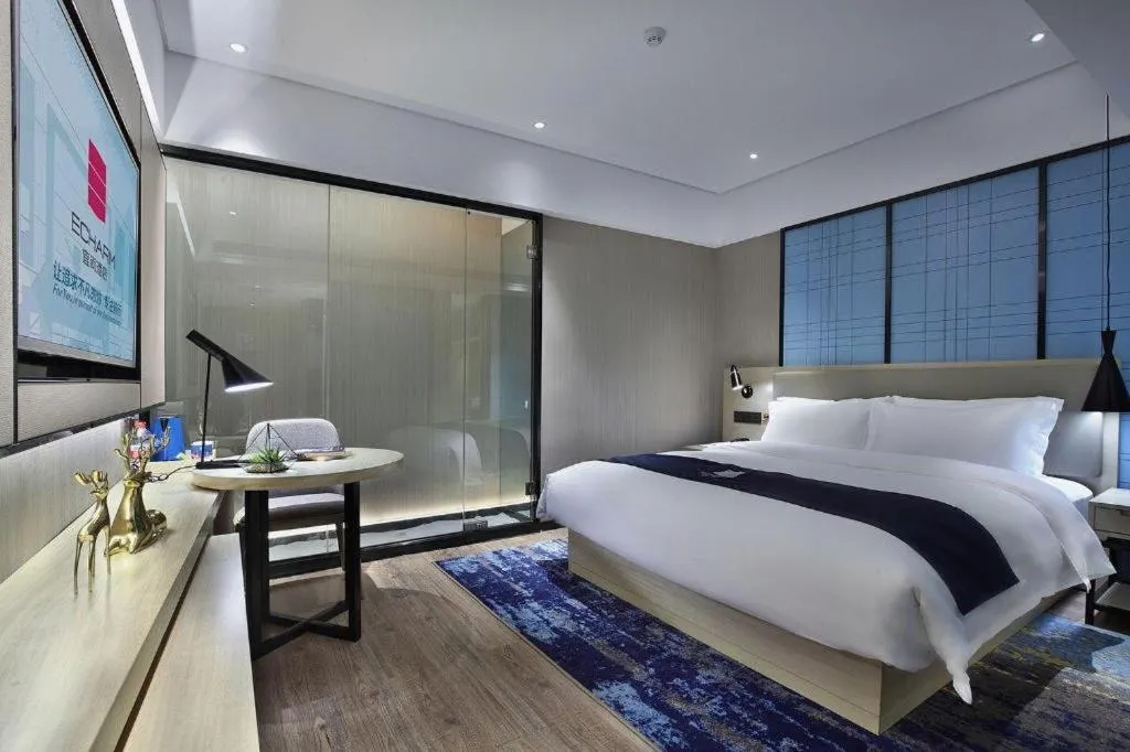 Bed in Echarm Hotel Guilin North High Speed Railway Station