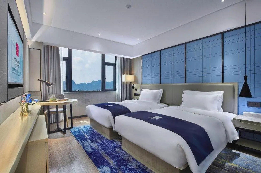 Bed in Echarm Hotel Guilin North High Speed Railway Station