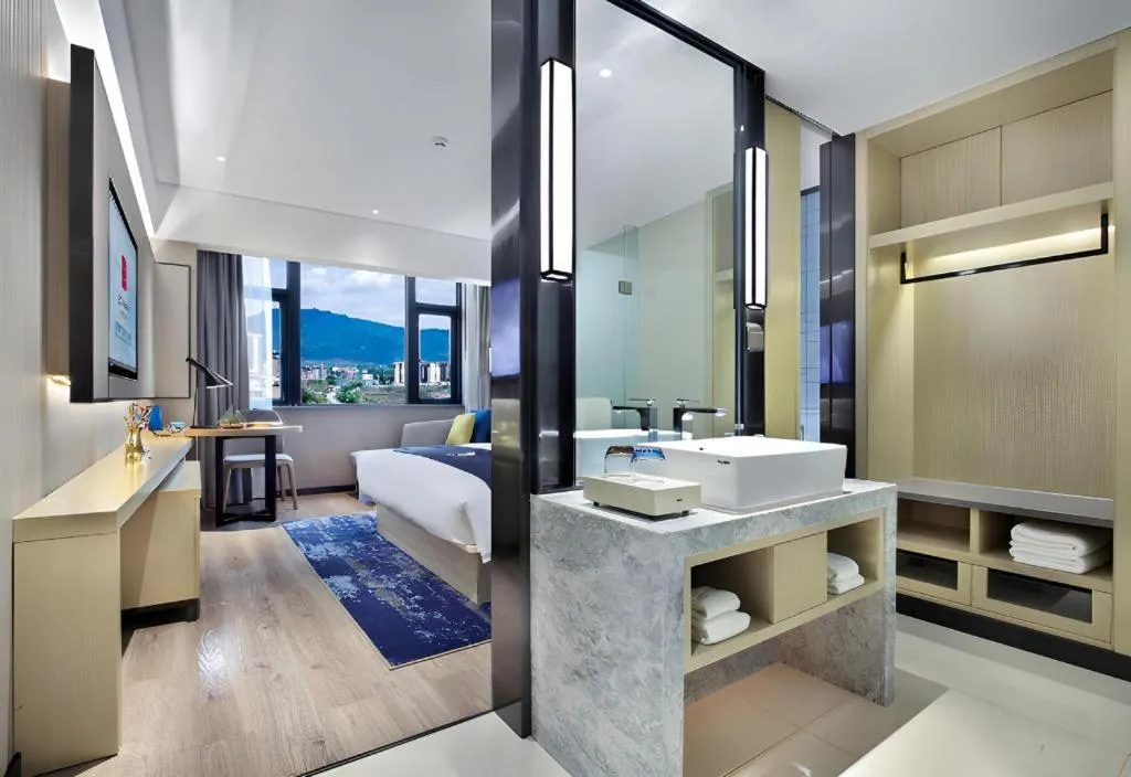 Bed in Echarm Hotel Guilin North High Speed Railway Station