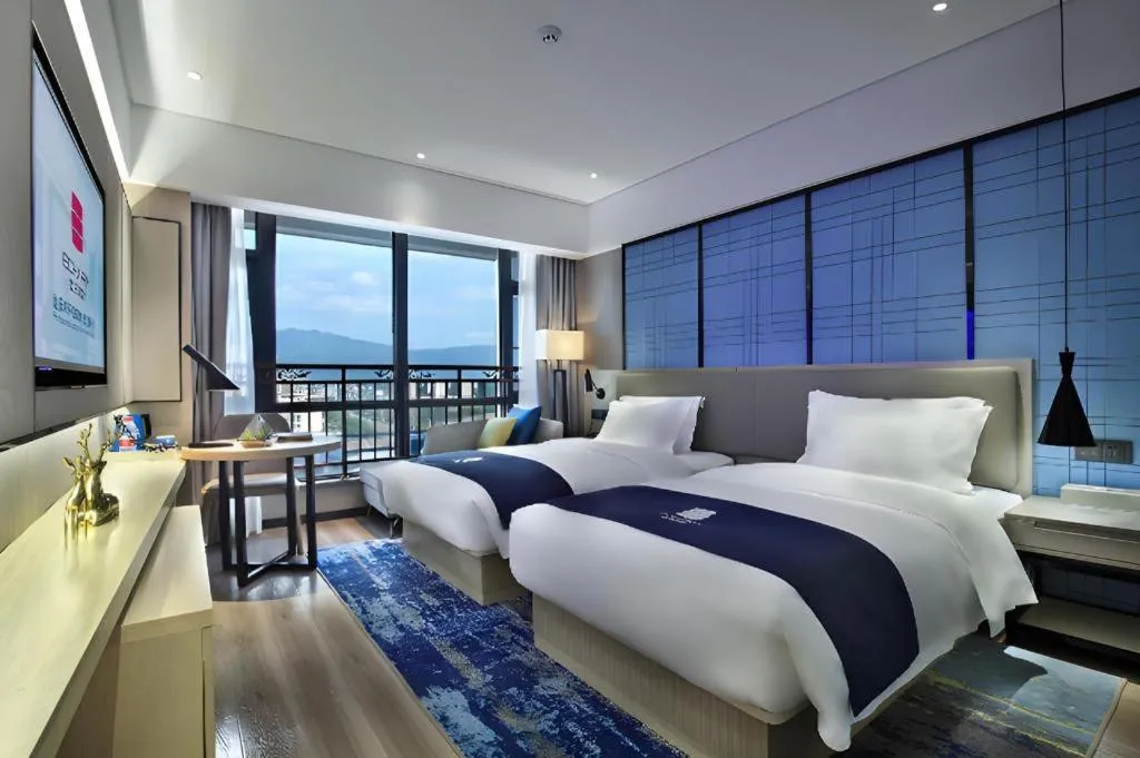 Bed in Echarm Hotel Guilin North High Speed Railway Station