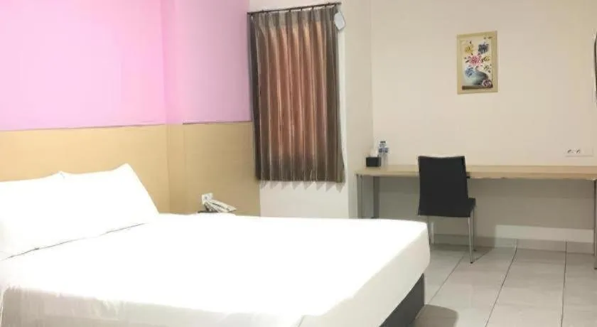 Bed in I&M Hotel Billiard