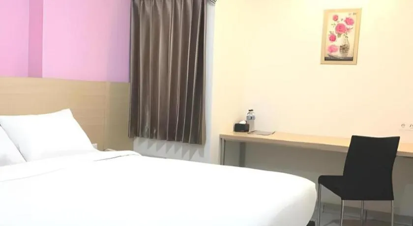 Bed in I&M Hotel Billiard